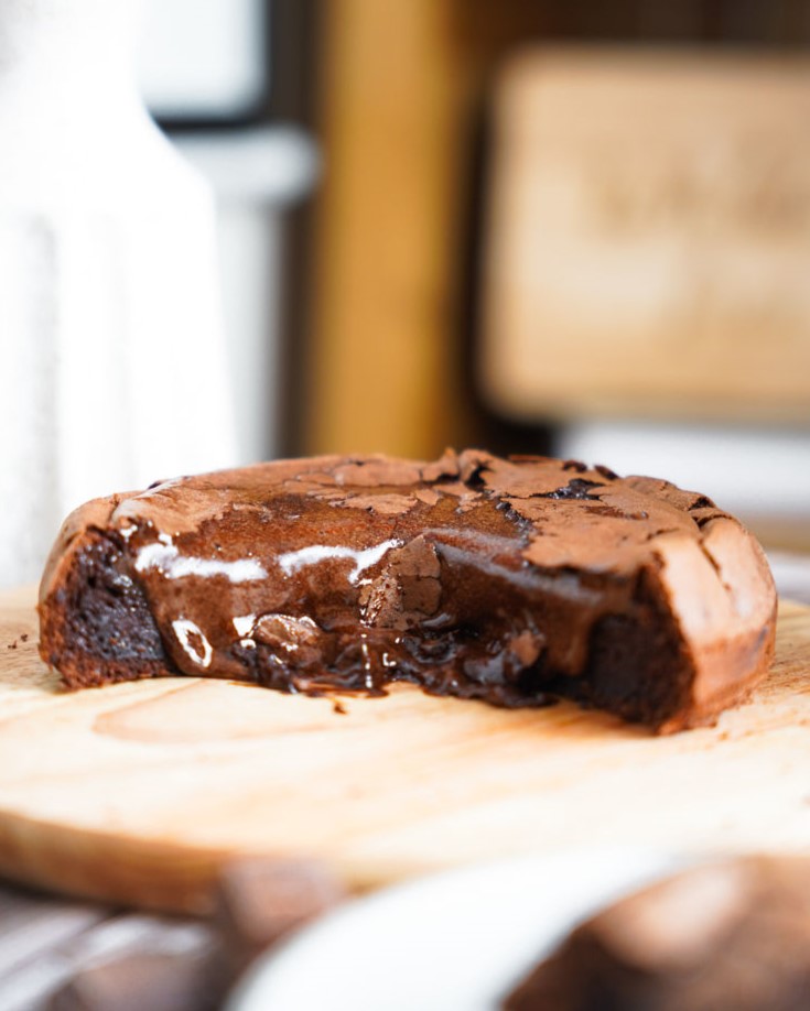 Grain-Free Giant Chocolate Lava Cake, cut open with oozing chocolate filling