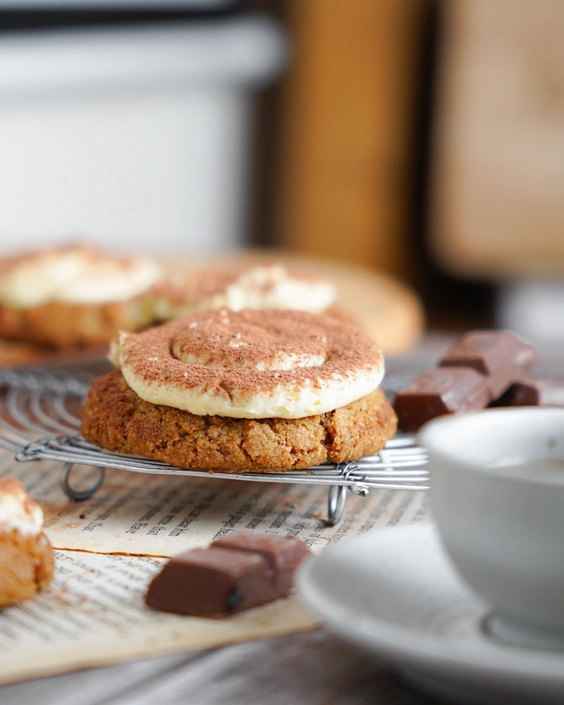 Grain-Free Tiramisu Cookies with cream cheese frosting and dusted with cocoa powder